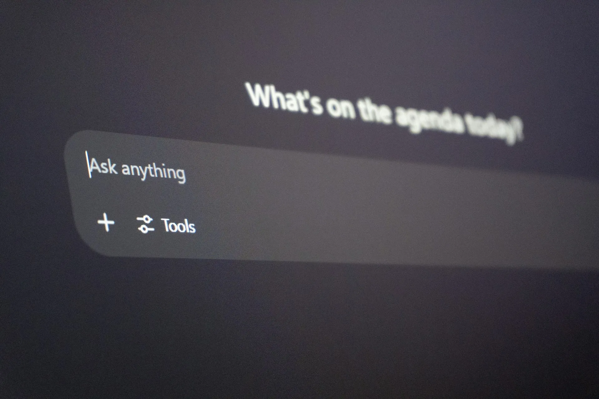 Close-up of an AI chat interface with an 'Ask anything' prompt box on screen