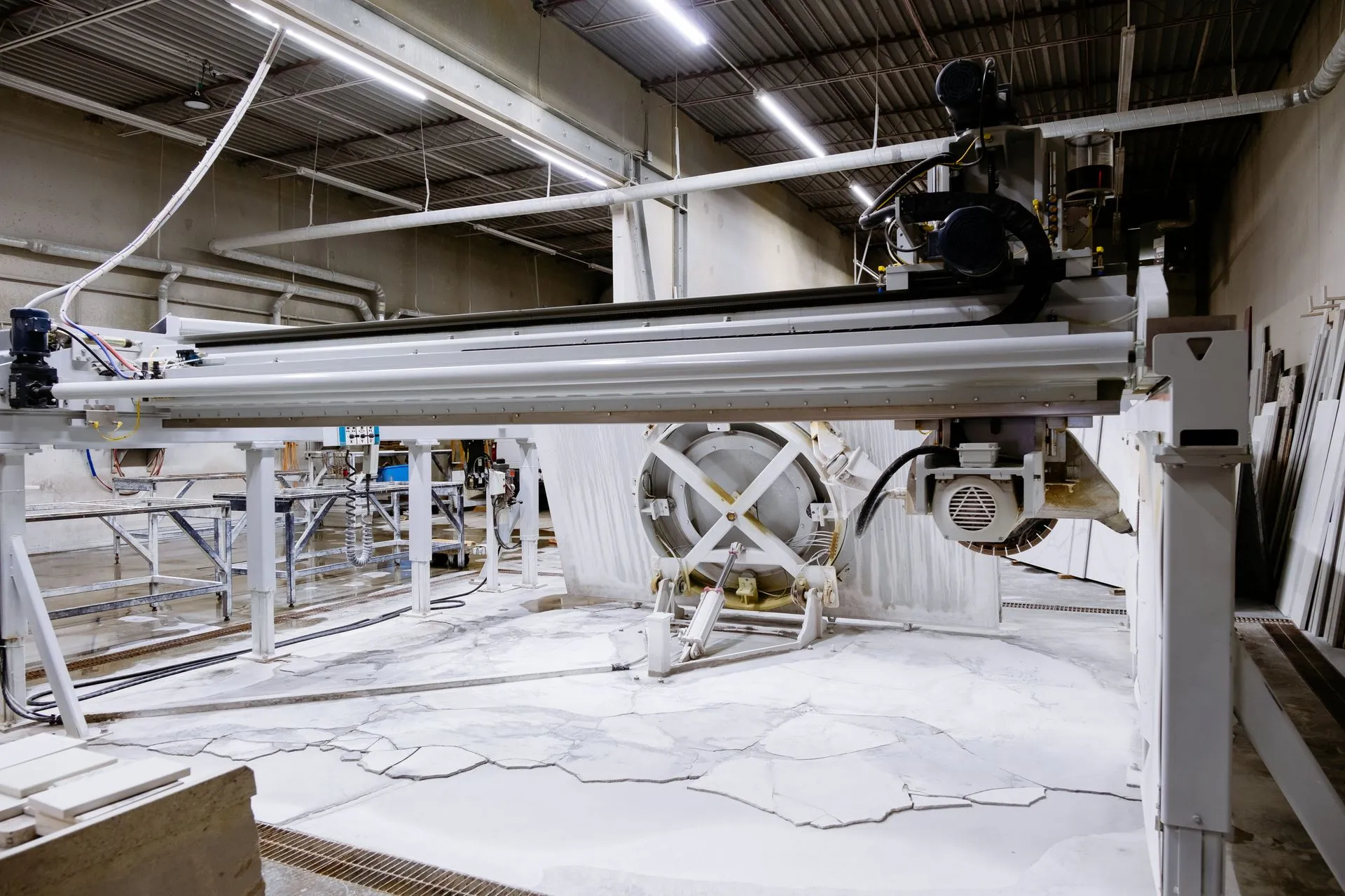 Industrial granite and stone cutting machine inside a factory workshop